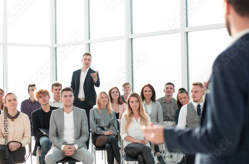 close up. speaker standing in front of the audience in the conference room