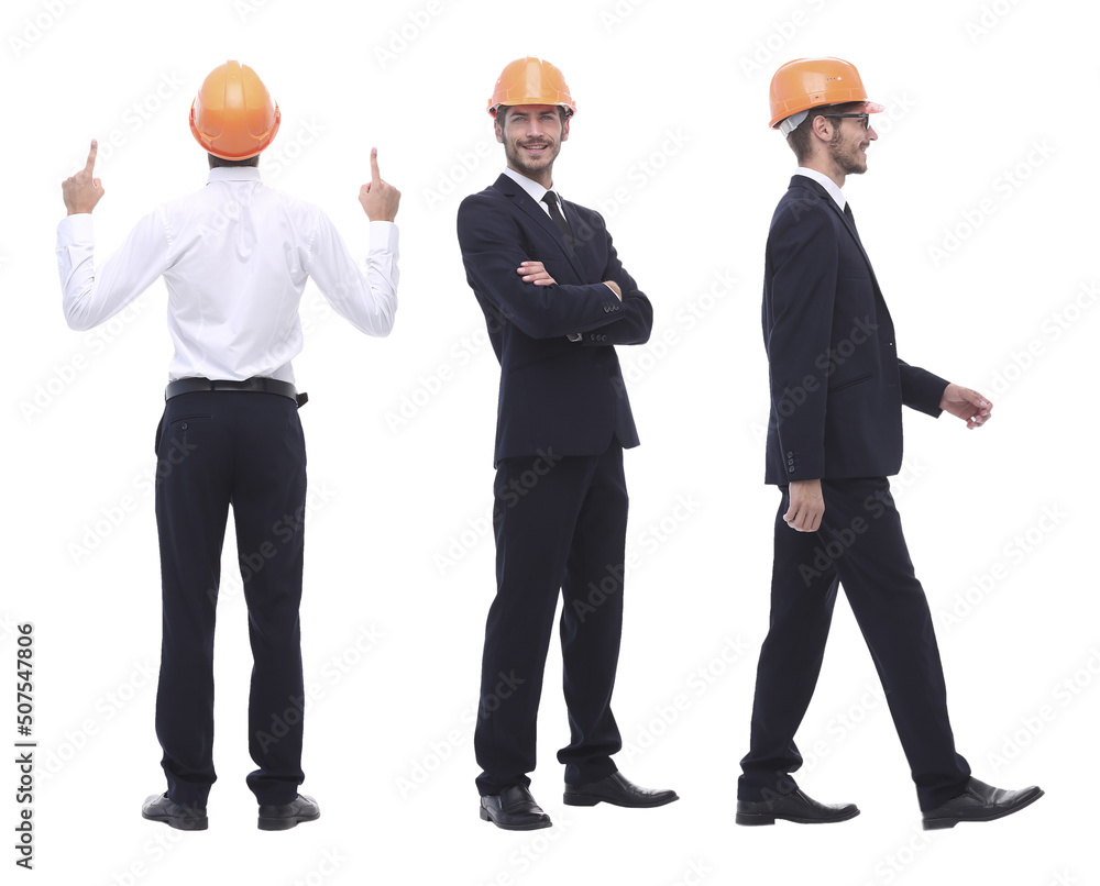 in full growth .a qualified architect in an orange helmet in full growth .a qualified architect in an orange helmet