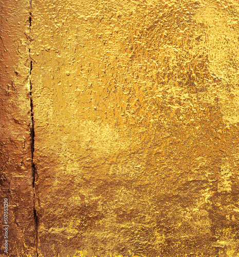 Precious Foil. Gold texture. Golden Ore rocks. Stone background. Abstract texture. Rock pile. Stone texture. Structure. Shimmering surface. Rough structure mineral. Rock texture.