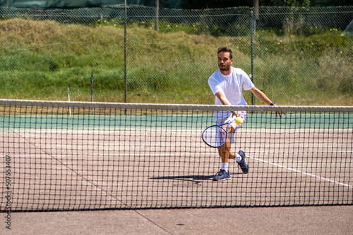 Tennis player performing a drop shot