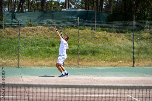 Tennis player performing a service