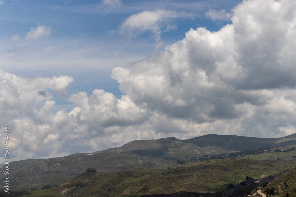 HUANCAVELICA, PERU - FEBRUARY 21, 2021: View of the sky in February from the city of Huancavelica. The sky is blue with cumulus clouds. HUANCAVELICA, PERU - FEBRUARY 21, 2021: View of the sky in February from the city of Huancavelica. The sky is blue with cumulus clouds.