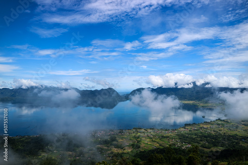 Danau Maninjau is an impressive volcanic lake at the bottom of an immense caldera measuring 20 kilometres by 8 kilometres and created about 50,000 years when a massive volcano erupted. © Fani