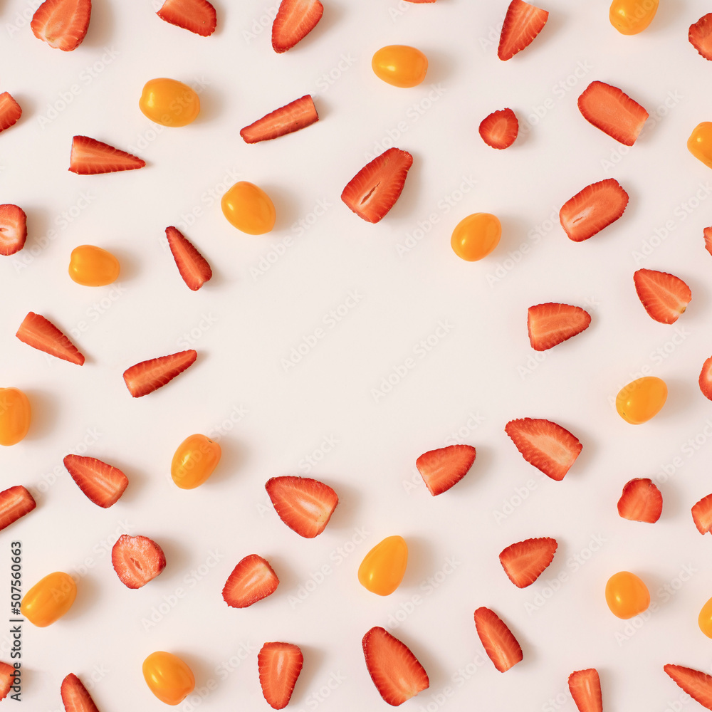 Colourful bright pattern made of kumquat fruit and strawberries. Flat lay. Colourful bright pattern made of kumquat fruit and strawberries. Flat lay.