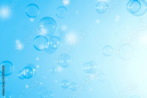 Transparent Soap Bubbles Floating on A Blue Background. Soap Sud Bubbles Water. 