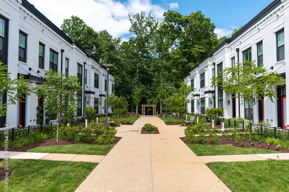 A walkway separates rows of townhouses in Potomac, Montgomery County Maryland.