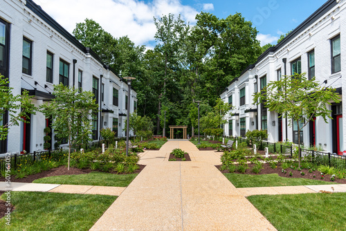 A walkway separates rows of townhouses in Potomac, Montgomery County Maryland. © MJ Kerr