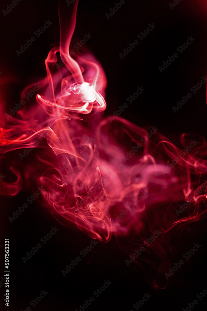 Fototapeta premium Red smoke motion on black background.