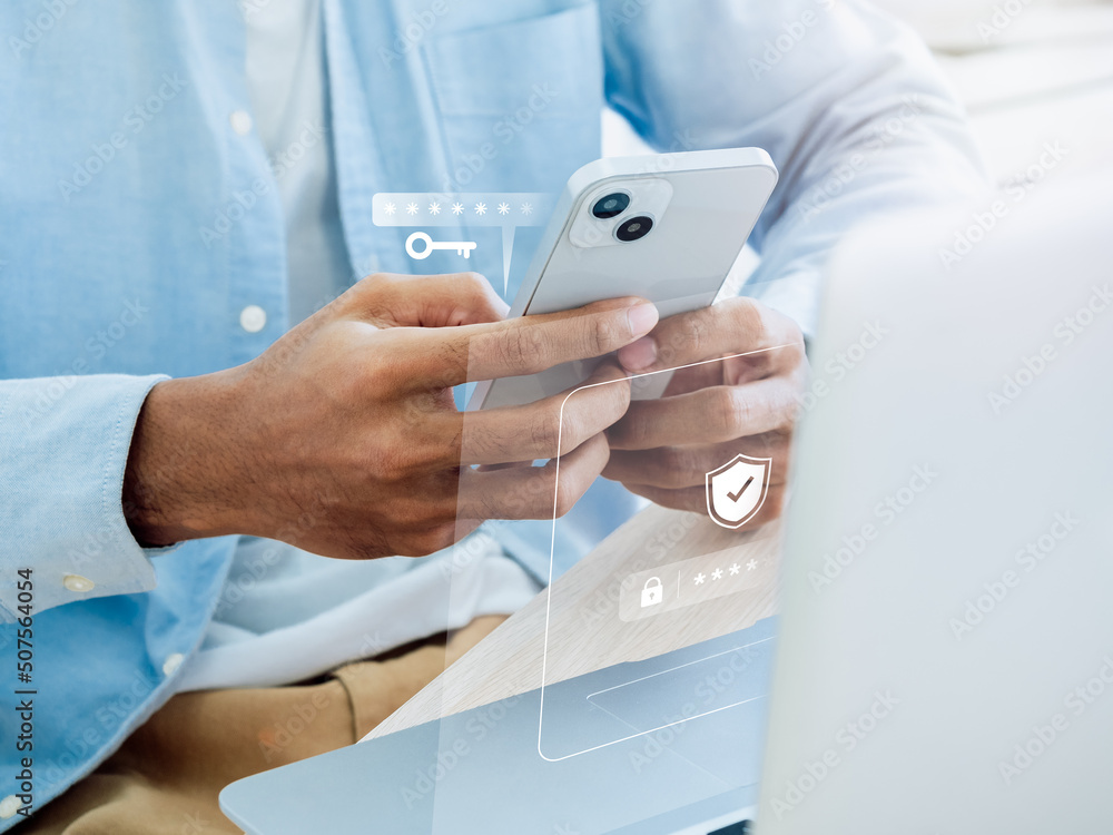 Two factor authentication or 2FA concept. Virtual key icon while access on phone with laptop for validate password, Identity verification, cybersecurity with biometrics authentication technology. Two factor authentication or 2FA concept. Virtual key icon while access on phone with laptop for validate password, Identity verification, cybersecurity with biometrics authentication technology.
