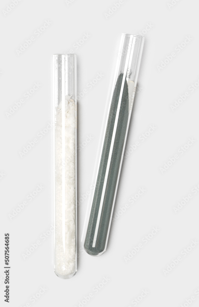 Closeup chemical ingredient on white laboratory table. Cetyl Esters Wax and Zinc Powder in test tube. Closeup chemical ingredient on white laboratory table. Cetyl Esters Wax and Zinc Powder in test tube.