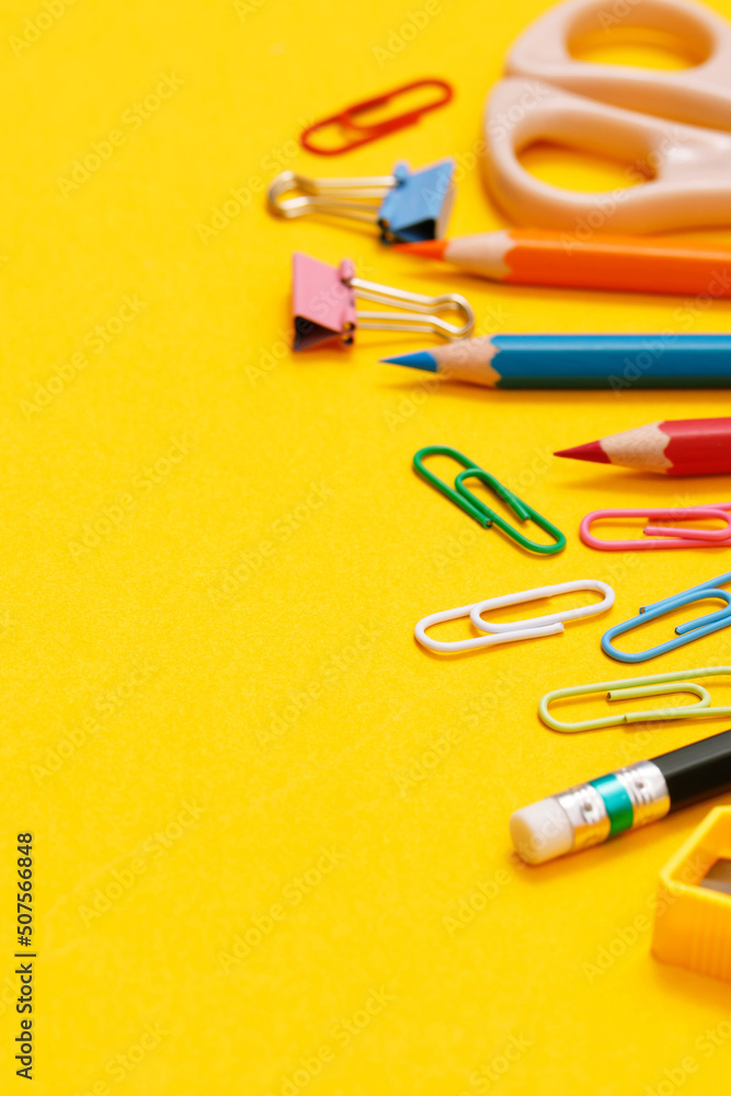 Top view notebooks and accessories studying in the library at school yellow background idea education Top view notebooks and accessories studying in the library at school yellow background idea education
