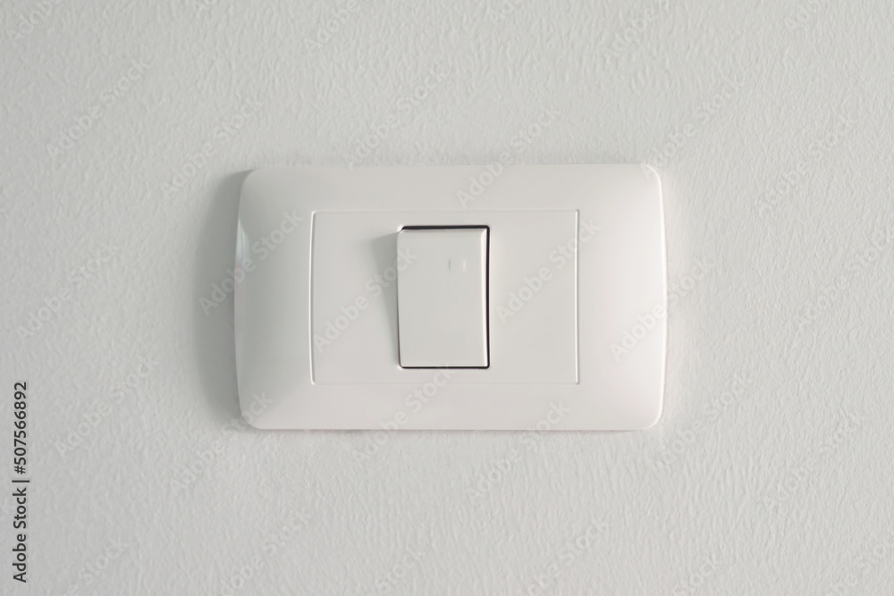 Electronic lighting switch with white wall background. home electrical power. Electronic lighting switch with white wall background. home electrical power.