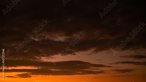 Evening Sky, twilight dramatic gold sunset dusk background. colorful sunlight cloud sky pastel bright yellow orange backdrop. nature landscape beautiful. © wing-wing
