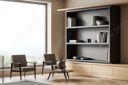 Living room interior with two seats, panoramic window and decoration on shelf © ImageFlow