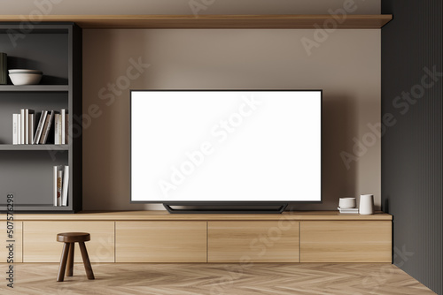 Фотография Living room interior with chair and tv set on drawer, mockup screen