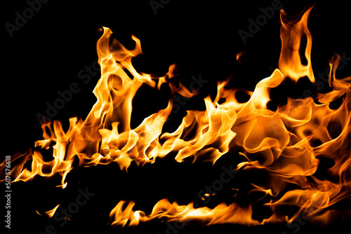 Fire flames isolated on black background. Fire burn flame isolated, flaming burning art design concept with space for text.