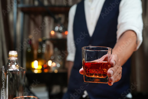 Bartender pouring Whiskey  on  bar 