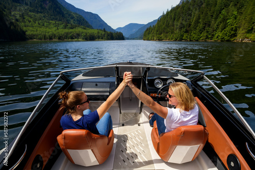 Females on vacation enjoying their speedboat trip Vancouver