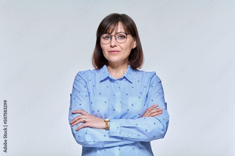 Portrait of a serious confident mature woman looking at the camera Portrait of a serious confident mature woman looking at the camera