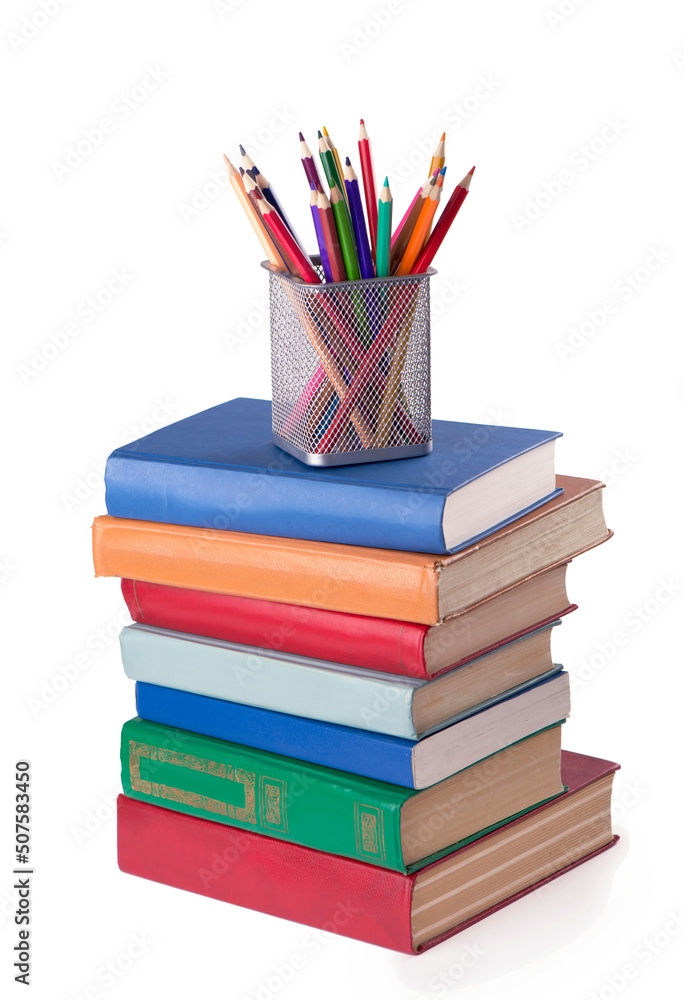 stack of Old books and color pencils isolated on white stack of Old books and color pencils isolated on white