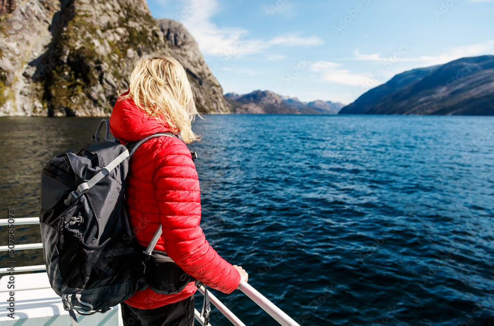 Caucasian female relaxing on boat trip scenic Norway