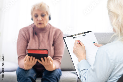 Psychologist comforting a depressed woman during a mental therapy session at the office, lady need of professional help