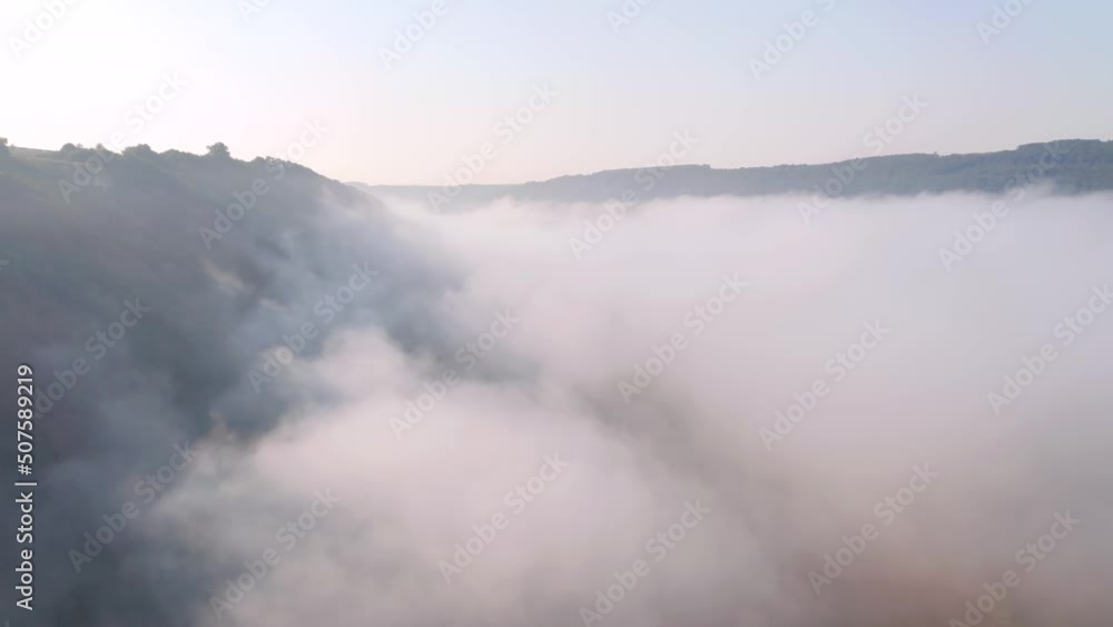 Gorgeous landscape covered with thick morning fog. Filmed in UHD 4k video. Gorgeous landscape covered with thick morning fog. Filmed in UHD 4k video.
