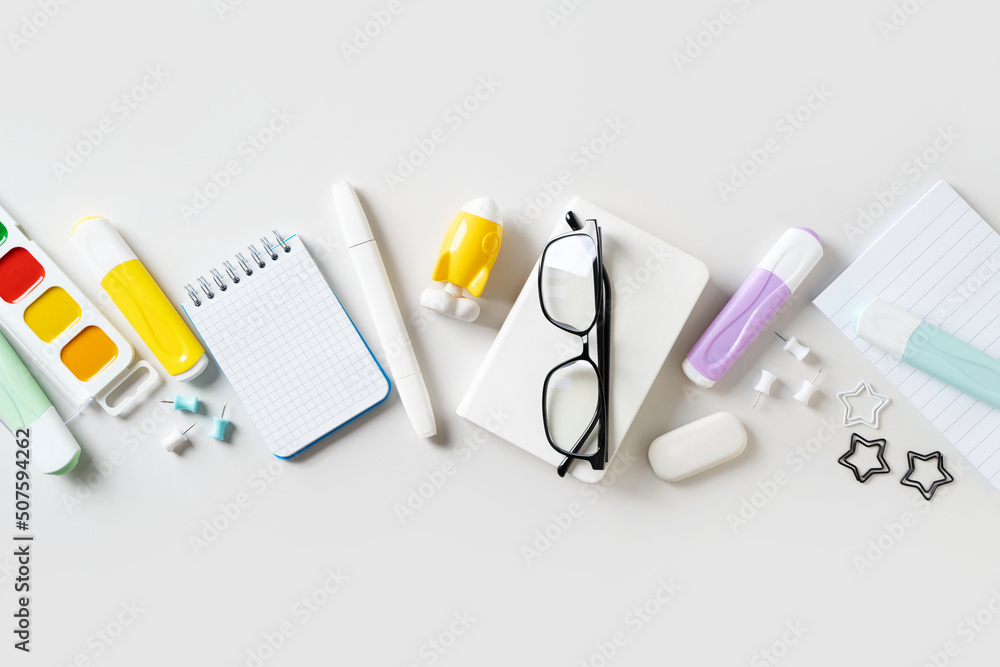 Back to school theme with white schools tools on white background Back to school theme with white schools tools on white background
