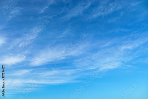 bright blue sky with clouds as abstract background