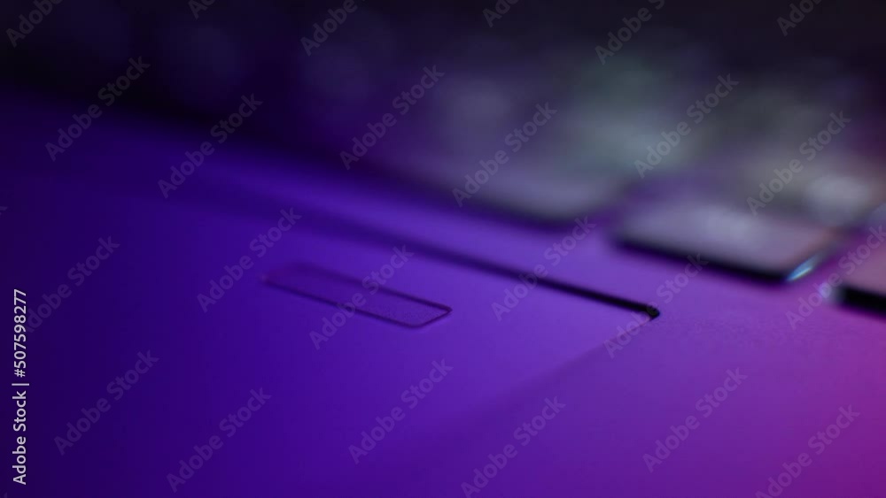 Fingerprint scanner on the laptop touchpad surface. Touchpad with a