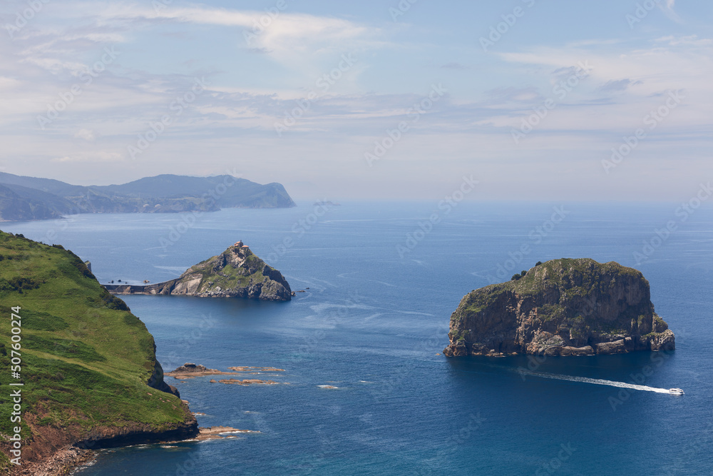 Gaztelugatxe with another small neighboring island, Aketx, they form protected biotope that extends from the town of Bakio to Cape Matxitxako, Bay of Biscay, Basque Country, Spain