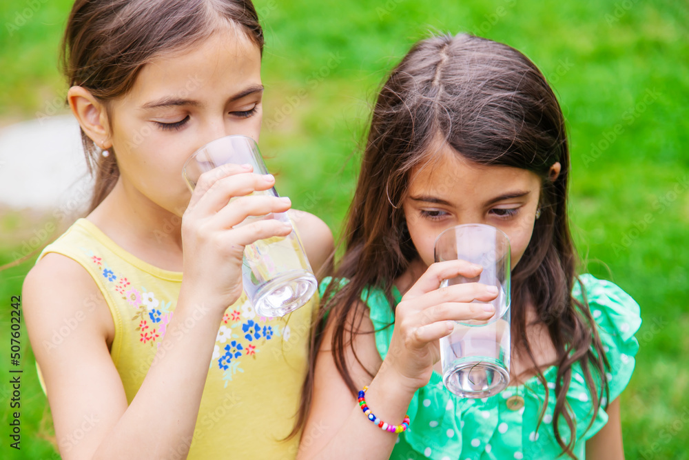 children drink clean water in nature.selective focus children drink clean water in nature.selective focus
