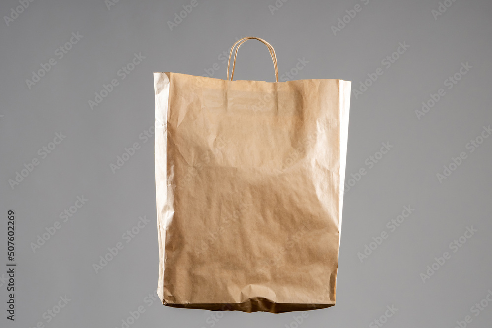 Stockfoto med beskrivningen Kraft paper bag. Paper bag without