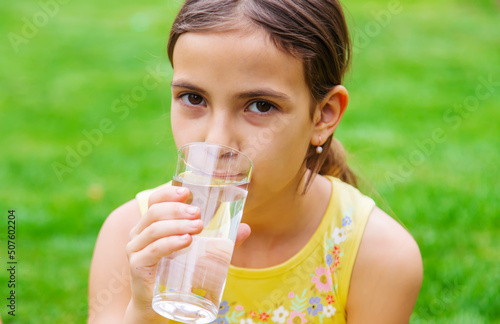 children drink clean water in nature.selective focus