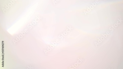 gentle light background, abstraction movement glare. light passes through the facets of a slowly rotating diamond and creates repetitive sparkling highlights