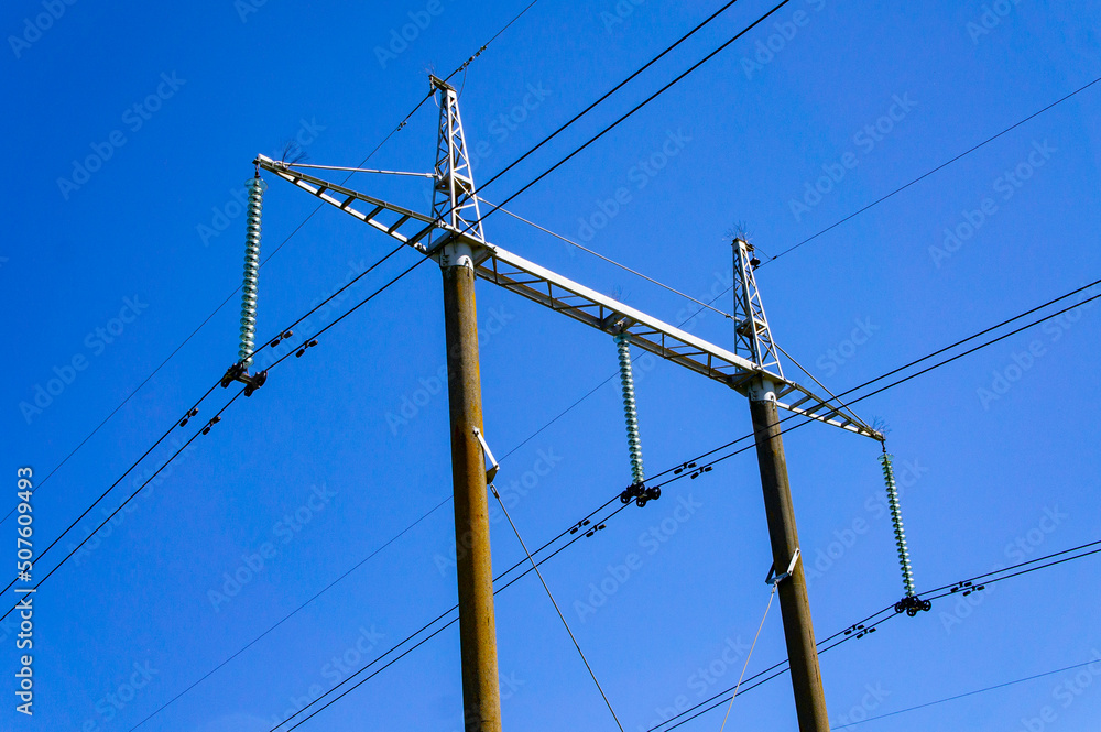 Power lines with cables and metal towers Power lines with cables and metal towers