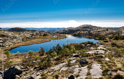 Obraz na płótnie A small scenic lake next to Lifjel summit in a beautiful sunny day, Sandnes, Norway, May 2018 w salonie
