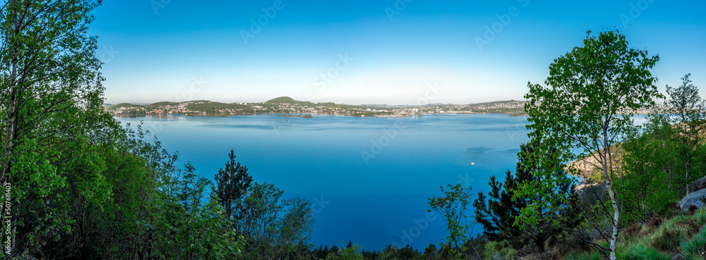 A scenic panoramic view of Gandsfjord still waters and Stavanger suburbs coastline from a Lifjel hiking trek, Sandnes, Norway, May 2018