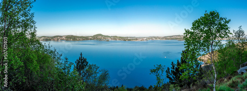 Obraz na płótnie A scenic panoramic view of Gandsfjord still waters and Stavanger suburbs coastline from a Lifjel hiking trek, Sandnes, Norway, May 2018 w salonie