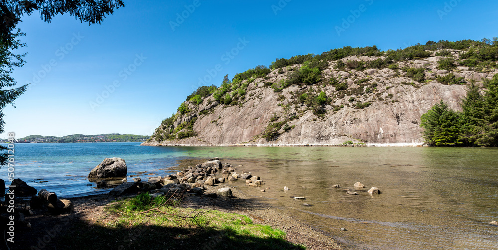 A small bay with turquoise water in Gandsfjord fjord near Dale, Sandnes, Norway, May 2018