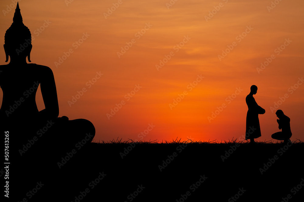 Silhouette with black buddha and people worshiping monks on sunset background. Silhouette with black buddha and people worshiping monks on sunset background.