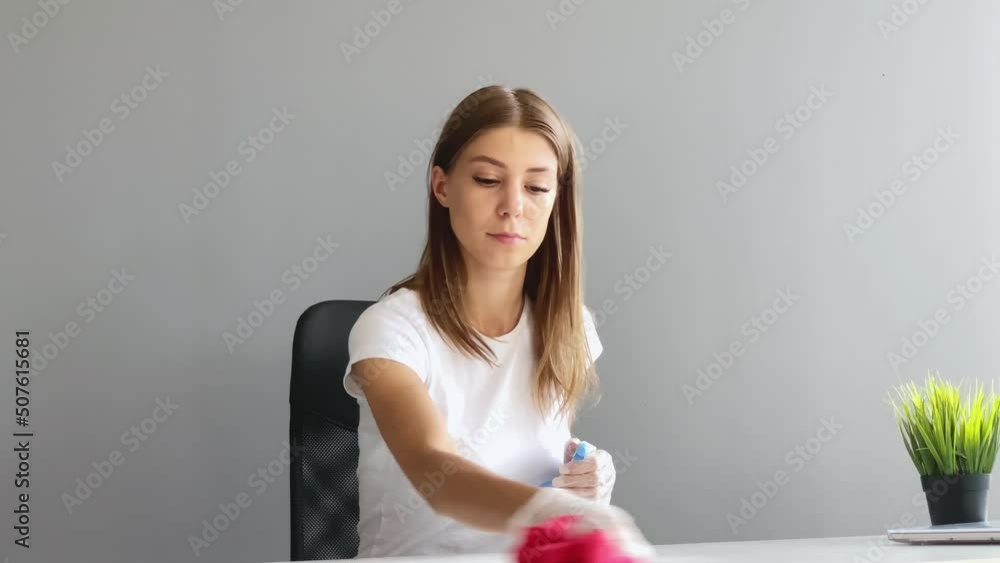 Portrait Of Happy Female Janitor Cleaning Desk At Office Portrait Of Happy Female Janitor Cleaning Desk At Office