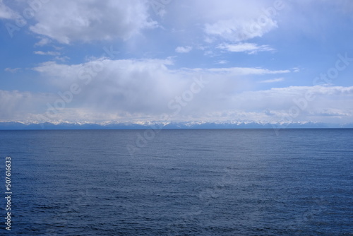View of the snow-capped mountains of the eastern shore of Lake Baikal, May 2022