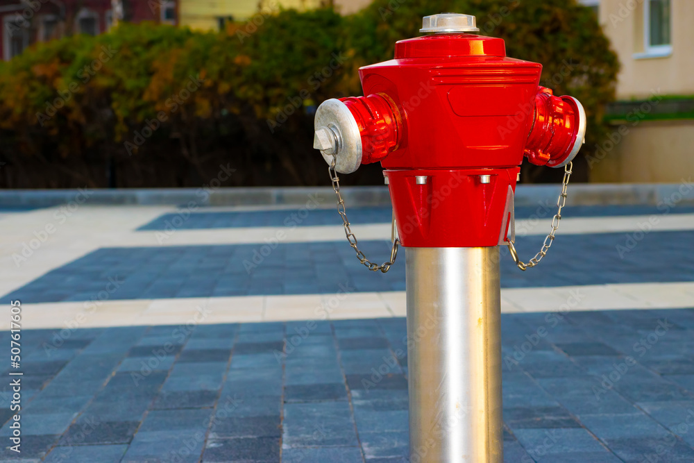 red fire hydrant on the sidewalk in the city red fire hydrant on the sidewalk in the city