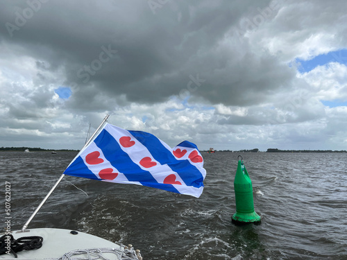 Frisian flag at a boat on the Sneekermeer photo