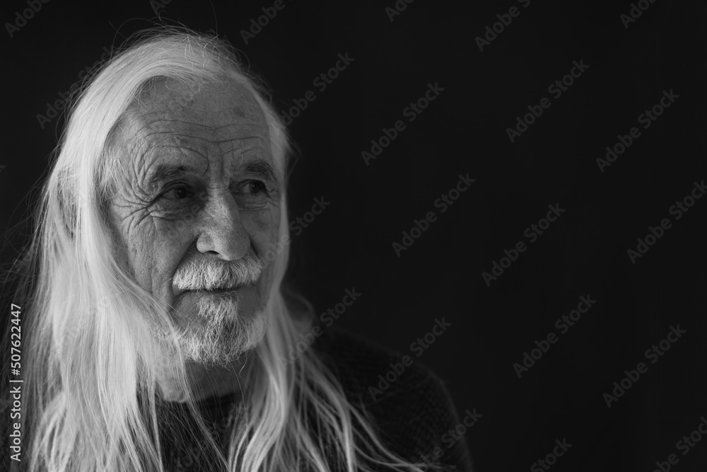 Low Key Studio Portrait of Long Gray Hair Old Man Closeup. Horizontally. Low Key Studio Portrait of Long Gray Hair Old Man Closeup. Horizontally.