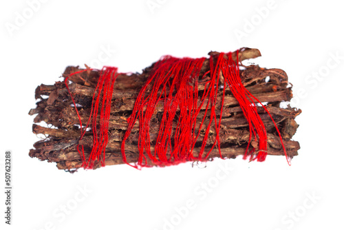 Root of Rubia tinctorum for medical use, eating or coloring isolated on white background. photo