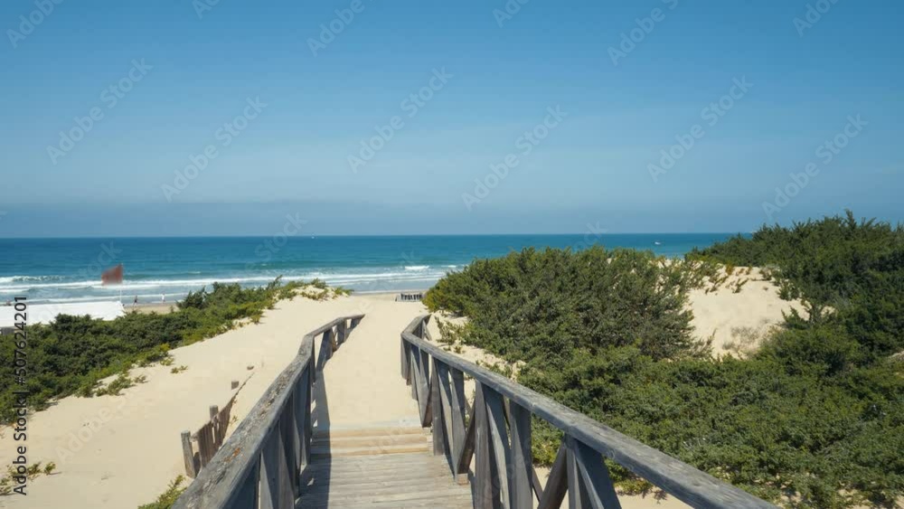 Beautiful footpath to the beach in Spain (Andalusia) in the dunes Beautiful footpath to the beach in Spain (Andalusia) in the dunes