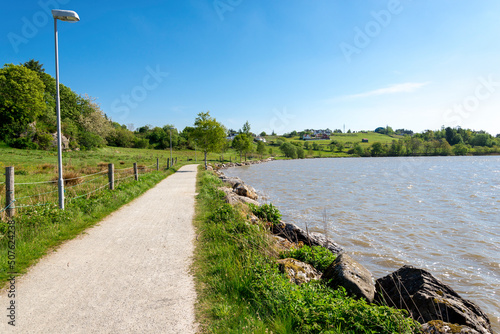 Obraz na płótnie A gravel path around Halandsvatnet lake for walking, jogging, running and cycling activities, Stavanger, Norway, May 2018 w salonie