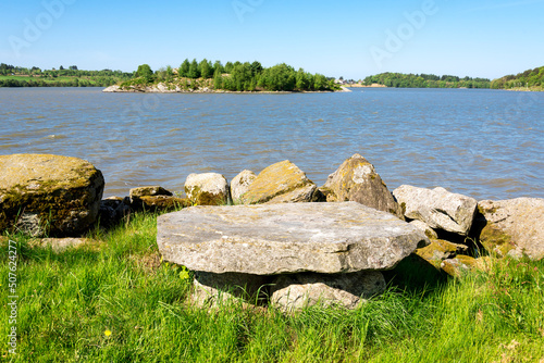 Obraz na płótnie A solid stone table at the shore of Halandsvatnet lake, Stavanger, Norway, May 2018 w salonie